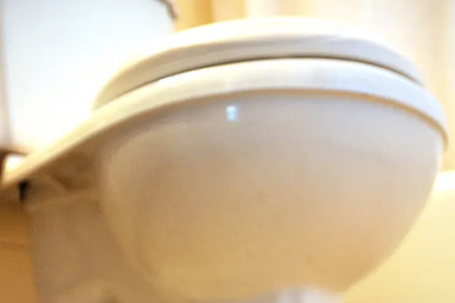 How do you unclog a toilet fast when the bowl is full?